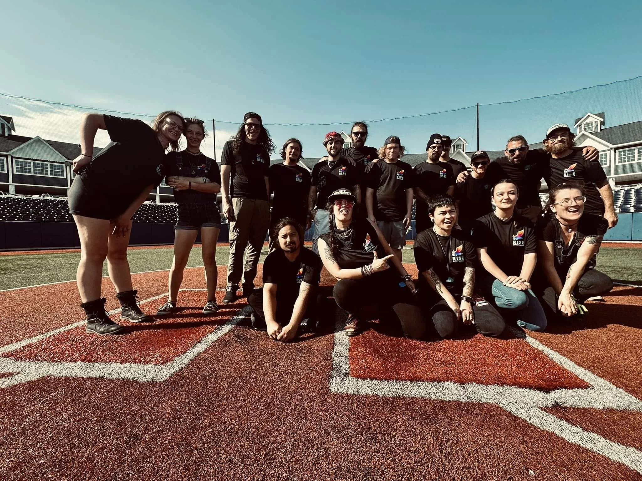 Group of people on baseball field