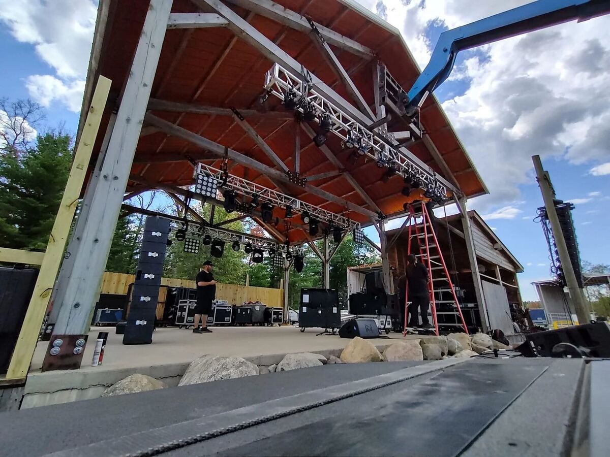 Stage truss and infrastructure build at an outdoor venue