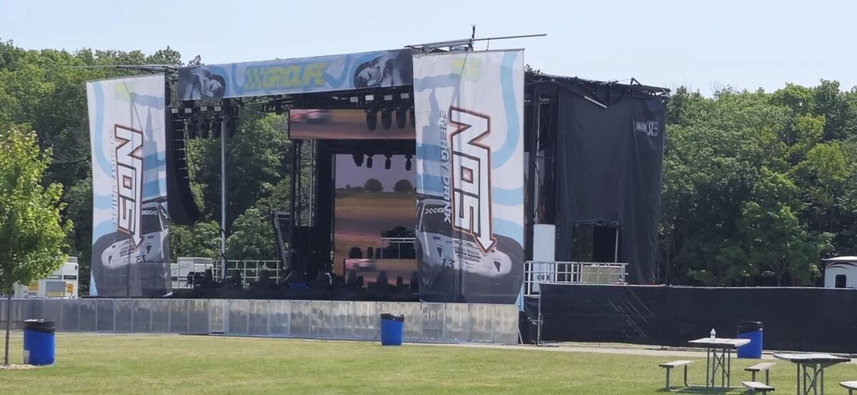 Outdoor stage with video screens during the day