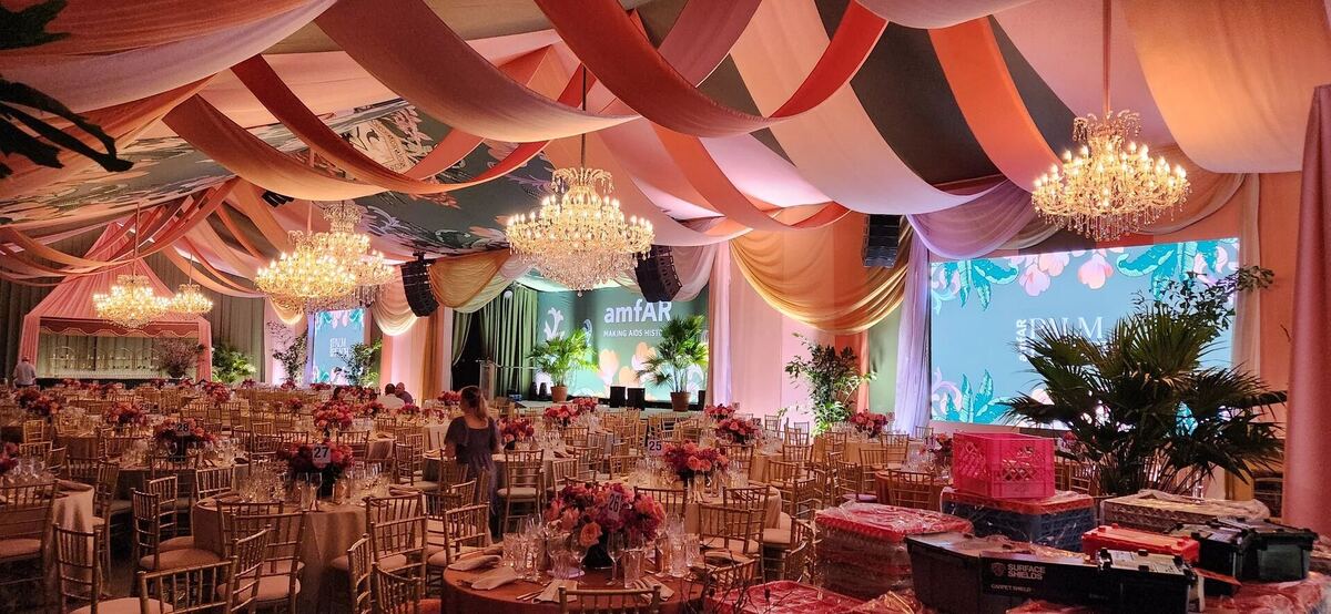Tent interior with colorful draped ceiling