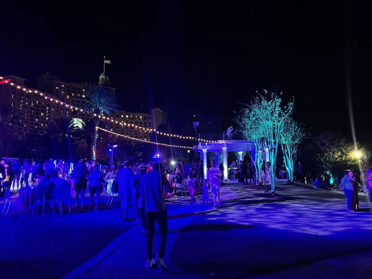 Nighttime outdoor lounge with string lights